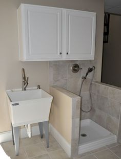 a bathroom with a sink and shower in it