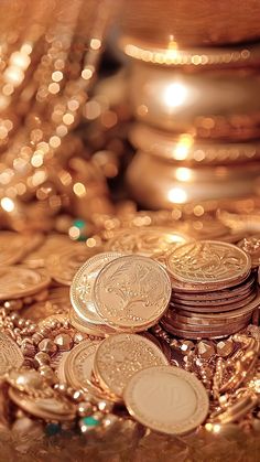 a pile of gold coins sitting on top of a table