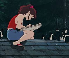 a woman sitting on top of a roof reading a book next to birds flying around