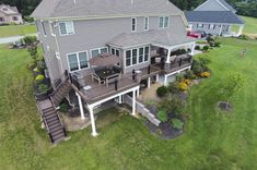 an aerial view of a house with deck and patio