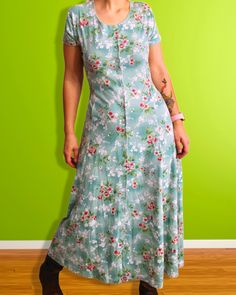 Vintage 1990's floral maxi dress Brand: Erika studio (90s) Color: turquoise Material: Cotton/polyester blend Additional Info: Buttons up the front. Stretchy! Ties around back. Size/Measurements: Labeled M Bust up to 40" Waist up to 38" Hips up to 52" Length 47" Turquoise Floral Print Maxi Dress, Casual Turquoise Floral Print Maxi Dress, Casual Turquoise Maxi Dress With Floral Print, Spring Floral Print Full-length Maxi Dress, Casual Fitted Turquoise Maxi Dress, Fitted Floral Print Full-length Maxi Dress, Fitted Turquoise Maxi Dress For Spring, Turquoise Fitted Maxi Dress For Spring, Garden Core