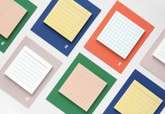 several pieces of paper are arranged on top of each other, with different colors and sizes