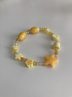 yellow star braclet. looks very petty in sunlight and and is in great condition. is a size medium but can stretch if wanted. Yellow Bead Bracelet Ideas, Yellow Beaded Bracelet, Cute Handmade Yellow Beaded Bracelets, Yellow Bracelet Ideas, Trendy Handmade Yellow Bracelets, Yellow Beaded Bracelets, Yellow Bracelet Beads, Yellow Bracelet, Jewerly Making