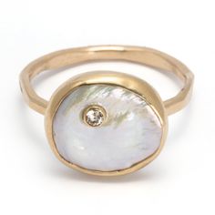 A distinctive and elegant design that features a white, freshwater Keshi pearl. Framed in the metal of your choice, each luminous pearl is set with a 2 mm faceted, tube set gemstone. This modern, minimalist design is perfect for everyday and can transition easily from day to night. Worn alone or with additional stacking bands this captivating ring is sure to turn heads. Vintage Costume Rings, Gift For Designer, Keshi Pearl Ring, Stone Settings Jewelry, Kate Davis, Tahitian Pearl Ring, Pearl Rings Vintage, Modern Minimalist Design, Stacking Bands