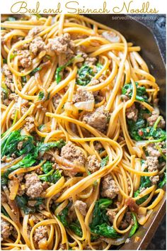 pasta with meat and spinach in a skillet