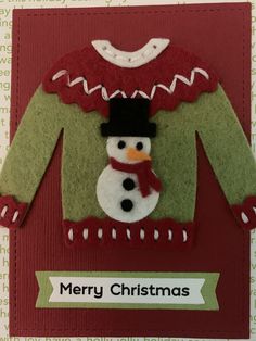 a christmas card with a snowman sweater on it