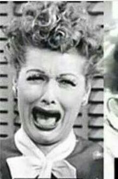 an old black and white photo of two people with their mouths open, one is screaming