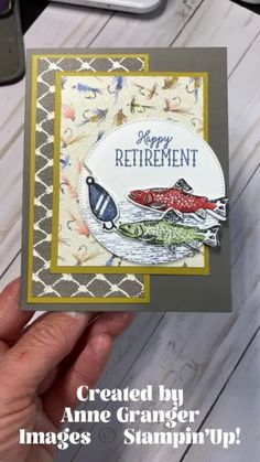 someone is holding up a card that says, happy retirement with two fish on it