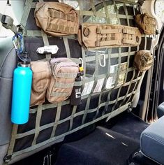 the back seat of a car with various items on it