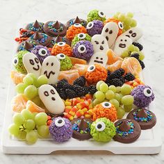 a white platter filled with halloween treats