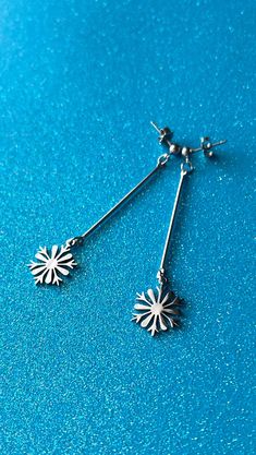 These adorable snowflakes are part of a collection of 100% stainless steel earrings, and I am launching one pair a month! How cute are these November earrings?! They are 2.625” long and .625“ wide and entirely made from stainless steel! Aren't they giving major winter vibes?! That means they are super hypoallergenic, they can get wet without tarnishing, and they're super light weight! Even though these earrings are simple, they're totally a statement. I love how silver goes with anything and eve Twst Oc, Winter Jewelry, Oc Inspo, Snowflake Earrings, Winter Vibes, Steel Earrings, Stainless Steel Earrings, Earings Piercings, A Month