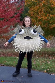 My daughter has been obsessed with Puffer fish, so we knew we would need to be creative to make her a costume this Halloween! We started with 6 layers of papier mache over an exercise ball, cut out head and arm holes, then spray painted... Puffer Fish Costume, Fish Costume Diy, Diy Fish Costume, Nemo Costume, Sea Costume