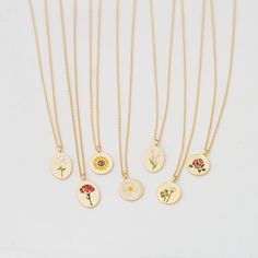 "These beautiful and dainty flower collection disk necklaces are made from 18ct gold plated metal, the pendants show different designs, choose your favorite flower your heart desires.. This is the perfect gift for you and your loved ones.❤ D E T A I L S * Delicate floral designs on circle or oval shaped disks * Each flower indicates; ▸ Lily (oval): purity & devotion ▸ Carnation (oval): love & gratitude ▸ Sunflower: loyalty & good fortune ▸ Daisy: hope & peace ▸ Tulip (oval): perf Delicate Flower Charm Necklace Gift For Her, Delicate Flower Charm Necklace For Her, Dainty Flower Pendant Necklace As Gift For Mom, Dainty Birth Flower Necklace As Gift For Her, Delicate Charm Necklace With Flower Pendant, Dainty Birth Flower Charm Necklaces, Delicate Flower Charm Round Pendant Necklace, Dainty Birth Flower Charm Necklace With Flower Pendant, Delicate Charm Necklace With Round Flower Pendant