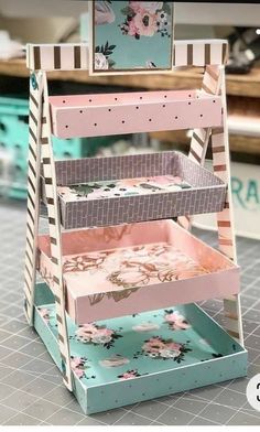 this is an image of a shelf made out of cardboard and other crafting supplies