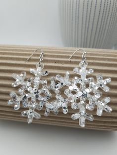 . Holiday Silver Drop Earrings, Silver Holiday Drop Earrings, Silver Earrings For Holiday Parties, Silver Drop Earrings For Holidays, Silver Jewelry For Winter Parties, Snowflake Sparkling Earrings For Gift, Winter Party Dangle Jewelry, White Winter Party Jewelry, Winter Festive Dangle Earrings