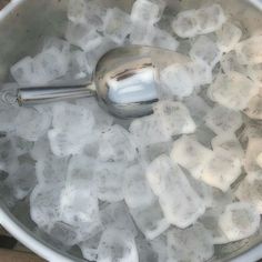 ice cubes and a spoon in an ice bucket