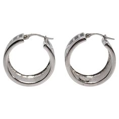 Sterling silver Roman Numeral hoop earrings by Flli Menegatti. Wide hoop earrings with silver Roman Numerals VIII thru XII on a black background. Measures approx 7/8" in diameter, 1/2" wide. Weighs approx 17.7g, 11.4dwt. Marked 925 Flli Menegati ITALY Very nice condition with some light surface scratching and very light tarnish. Will come packaged in a gift box or pouch when possible, and will be shipped US Priority Mail with insurance. CL081523/17KCS Roman Numeral, Roman Numerals, Jewelry Earrings Hoops, Priority Mail, Black Background, A Black, Black Backgrounds, Insurance, Gift Box