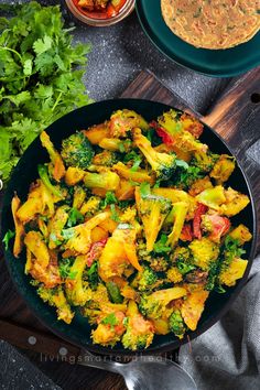 a pan filled with food next to some vegetables and sauces on a wooden cutting board