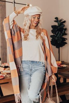 Layer up in warmth with our beautiful 'Sierra Nevada Poncho' featuring knit material pattern with pumpkin, charcoal/taupe, and cream hued accent stripes, oversized long sleeves, and an ultra draped open front silhouette that falls into an uneven mid-thigh length hemline with fringe trim detailing! Oversized Striped Outerwear For Layering, Oversized Striped Fall Outerwear, Cozy Orange Outerwear For Fall, Oversized Striped Outerwear For Fall, Long Orange Outerwear For Fall, Fall Striped Cardigan For Layering, Orange Fall Outerwear For Layering, Fall Orange Outerwear For Layering, Striped Cardigan For Fall Layering