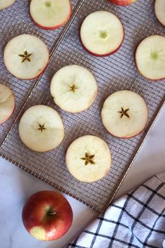 some apples are sitting on a cooling rack