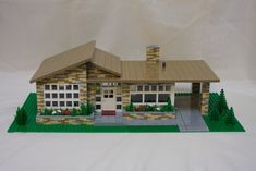 a lego model of a house on display