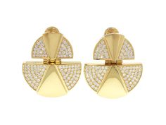 An architectural style for the fearless fashionista, these Modernist style diamond earrings are truly statement-making. High polish yellow gold forms a pair of half moon shapes with a smaller one suspending a larger. Both feature centered triangular motifs of high polish framed by a glittering expanse of pave diamonds. Luxury Diamond-cut Diamond-shaped Earrings, Luxury Modernist Earrings, Luxury 14k Gold Diamond-cut Earrings, Luxury Gold Modernist Earrings, Luxury Multi-stone Modernist Jewelry, Y2k Jewelry, Jewellery Marketing, Modernist Jewelry, Art Nouveau Design