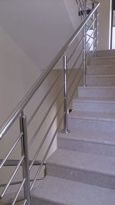 there is a metal hand rail on the stairs