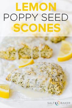 lemon poppy seed scones on a white plate with lemon wedges in the background