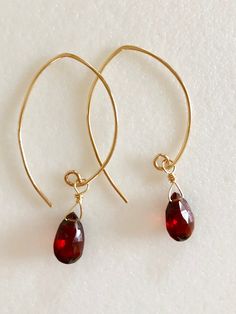 "Stunning rich red Luxe AAA Mozambique garnet earrings in 14k gold fill or Sterling silver. Beautiful 10/11x 7mm faceted rich burgundy red garnet pear briolettes wire wrapped on handmade 14k gold fill ear wires. These garnets are a gorgeous red color, clear and translucent. Total drop length is 1 3/4\"." Red Briolette Earrings For Anniversary, Elegant Red 14k Gold Filled Earrings, Elegant Red 14k Gold-filled Earrings, Red 14k Gold Teardrop Earrings, Gold Garnet Teardrop Earrings, Red Teardrop 14k Gold Earrings, Gold Teardrop Garnet Earrings, Red Garnet Wire Wrapped Earrings, Elegant Briolette Garnet Earrings