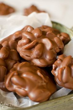 chocolate candies in a green bowl on a table