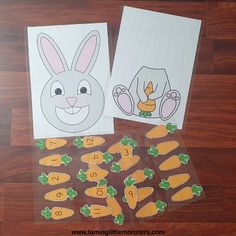 the bunny and carrots are cut out from paper