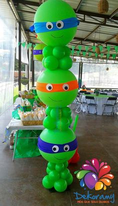 an inflatable turtle is on display at a birthday party with decorations and balloons