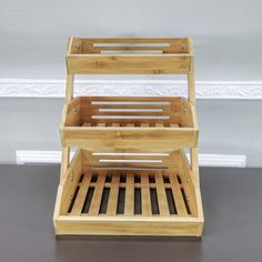 two wooden trays stacked on top of each other