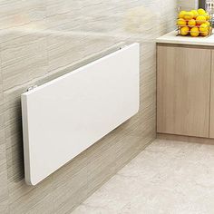 a white radiator mounted to the side of a wall