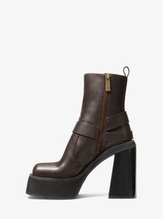 A moto boot with retro flair: our Crosby leather boot combines classic harness detailing with a soaring platform and heel reminiscent of ’70s style. Complete with a side-zip closure and square toe, it’s sure to be the standout of your cool-weather wardrobe. Retro Leather Platform Boots For Fall, Retro Leather Ankle Platform Boots, Black Moto Boots, Platform Combat Boots, Michael Kors Boots, Black Platform Boots, 70s Style, Leather Boot, Leather Moto