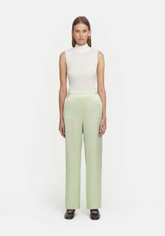 Viktoria & woods    pure silk pant in matcha green    the chauffeur trouser in matcha green captures the refined essence of our iconic pilot pants. crafted from 100% silk this pant boasts a wide-leg silhouette complemented by an elastic waistband and flat front for optimal comfort. versatile for everyday styling with v&w basics or a coordinated ensemble when paired with the countdown shirt or jacaranda polo in the matching hue.    made in australia    fits true to size.    kelsey is 5’9.5”/177cm Australia Fits, Blind Hem, Silk Pant, Silk Trousers, Matcha Green, Blue Flats, Silk Pants, Clothes Collection, Pure Silk