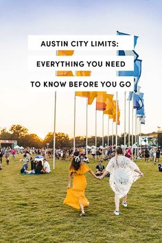 two women holding hands in front of flags with the words, austin city limits everything you need to know before you go