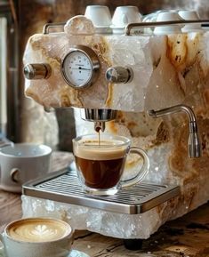 an espresso machine is being used to make cappuccino and coffee