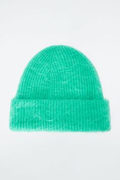 Offered in a fresh turquoise hue, this cozy beanie is knitted from a traceable mohair blend that's been certified by the Responsible Mohair Standard. It's ribbed to keep warmth in and has a soft, fuzzy hand feel and a wide fold-up brim. Certified by the Responsible Mohair Standard, to protect the welfare of the goats and their environment 72% RMS Mohair, 26% Polyamide, 2% Elastane Fold-up length: 3.34" Mohair Beanie, Belted Cape, Turquoise Scarf, Cozy Beanie, Mohair Scarf, Land Management, Modern Shoes, Accessories Bags Shoes, Opaque Tights