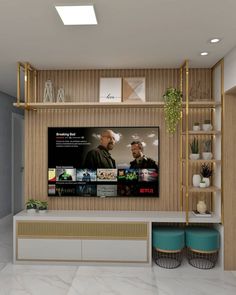 a tv is mounted on the wall in a room with shelves and potted plants