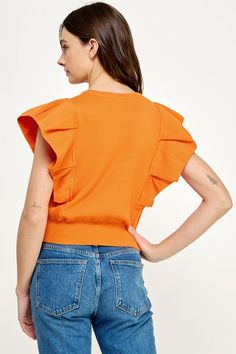 Orange deep V neck knit top with a dramatic pleated cap sleeve. 100% Nylon Casual Knit Top With Ruffle Sleeves, Solid Color Flutter Sleeve Tops For Fall, Solid Flutter Sleeve Tops For Fall, Fall Solid Color Tops With Flutter Sleeves, Fall Flutter Sleeve Solid Tops, Chic Knit Tops With Ruffle Sleeve, Trendy Spring Top With Cap Sleeves, Spring Stretch Tops With Cap Sleeves, Spring Stretch Knit Top With Ruffle Sleeves