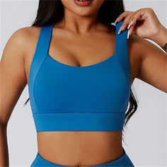 The Clio Sports Bra is here to support you through your toughest workouts. With built in cups and a wide supportive band, it offers full support for even the most intense activities. The unique hollow back cross strap design adds a stylish touch while providing extra support and comfort. Stay comfortable and confident with the Clio Sports Bra. Product Details: 75% Nylon/ 25% Spandex Built in cups Full support for high intensity workouts Wide straps and support band Hollow back cross strap design High Stretch Padded Sports Bra For Workout, Padded High Stretch Sports Bra For Training, Padded High Stretch Yoga Activewear, Padded Compression Activewear For Yoga, High Stretch Padded Yoga Activewear, Sports Activewear With Built-in Padding And Wide Straps, Functional Activewear With Wide Straps For Training, Functional Activewear For Training With Wide Straps, Functional Training Activewear With Wide Straps