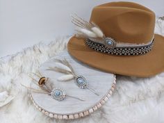 Concho Feather hat Pins!  Update your favorite western hat. Pin to shirt, jacket, purse, scarf, beanie, fedora or Bandana! Stick on your boots! Use as a lapel pin. looking for a unique Boutonniere? Or Lapel Pin. Add a pin almost anywhere!  Can be stuck anywhere. The possibilities are endless!  Choose from Boho Feather in cream, Boho Feather in tan or or Brown Feather! All pins have a stick pin back attached to add to your hat, hat band, lapel, or anywhere else you would like to add. Stick Pins: Feather Hat Pins, Unique Boutonniere, Embellished Hats, Band Inspiration, Boutonniere Pins, Hat Jewelry, Hat Bands, Felt Cowboy Hats, Western Hat