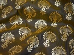 an image of a gold and black pattern on fabric