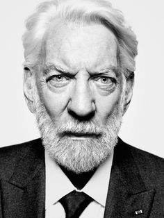 black and white photograph of an older man wearing a suit