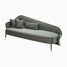 a gray couch with four pillows on it and two wooden legs, sitting against a white background