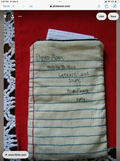 an old handwritten note is on top of a red sweater that says dear adn, this is to hour