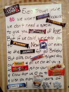 a letter written to someone on their birthday with candy bars and candies all over it