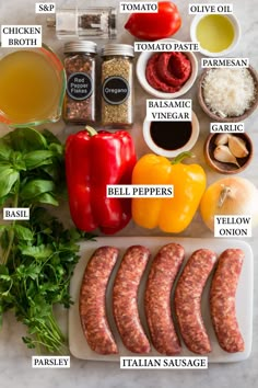 the ingredients to make italian sausages are shown on a cutting board with peppers, onions, garlic and seasonings