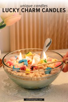 a bowl filled with lucky charm candles on top of a table